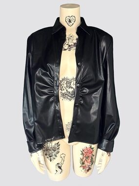 Black leather punk jacket with safety pins and chains